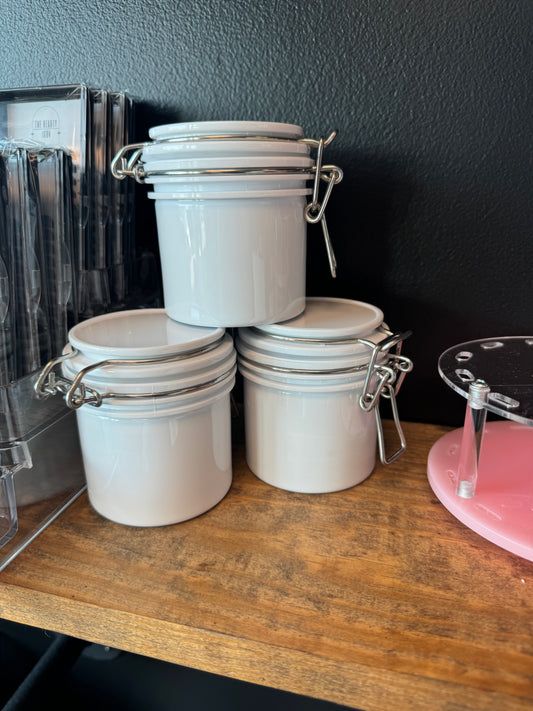 Adhesive storage containers